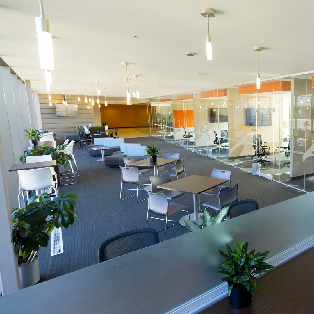 KU-Innovation-Center-Site-Photos-4152-1-sq A wide shot of seating outside of offices with glass walls at the KU Innovation Park in Lawrence